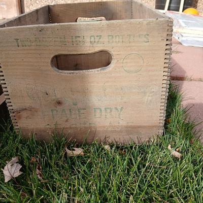 Wood crates with round wooden cheese container