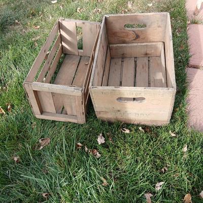 Wood crates with round wooden cheese container