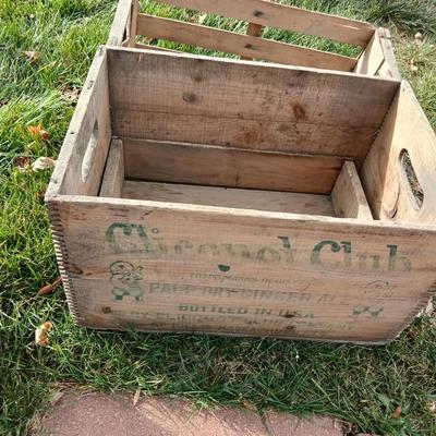 Wood crates with round wooden cheese container