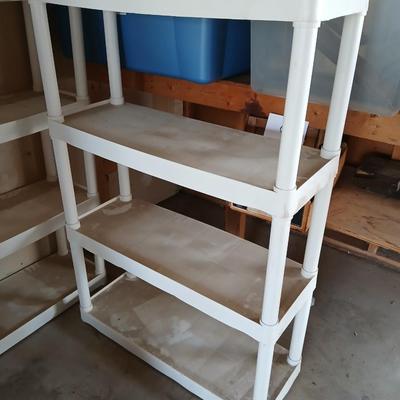Two plastic storage shelves