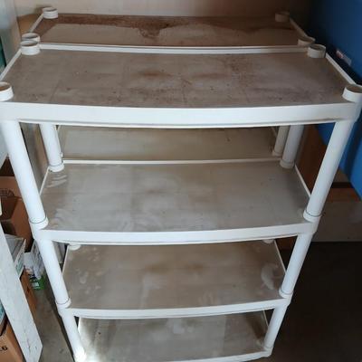 Two plastic storage shelves