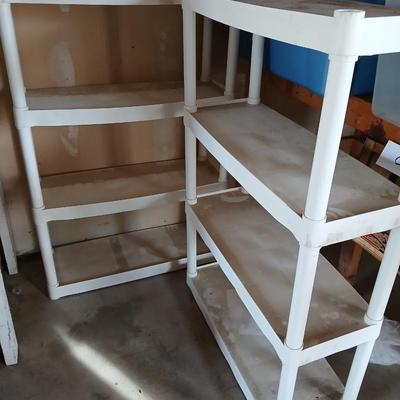 Two plastic storage shelves
