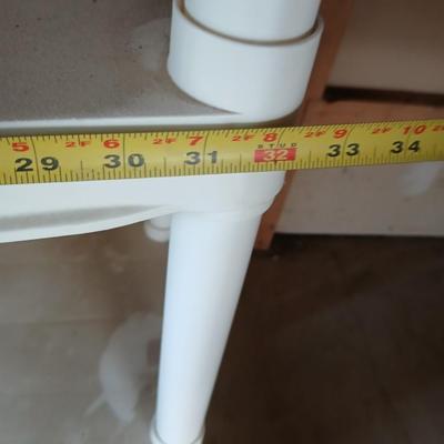 Two plastic storage shelves