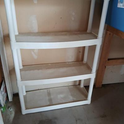 Two plastic storage shelves