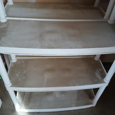 Two plastic storage shelves