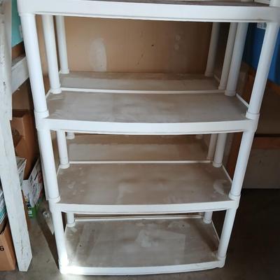 Two plastic storage shelves