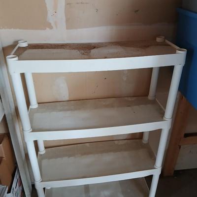 Two plastic storage shelves