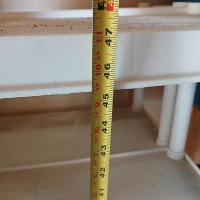 Two plastic storage shelves