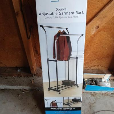 Opened Mainstays double Adjustable Garment / clothes rack