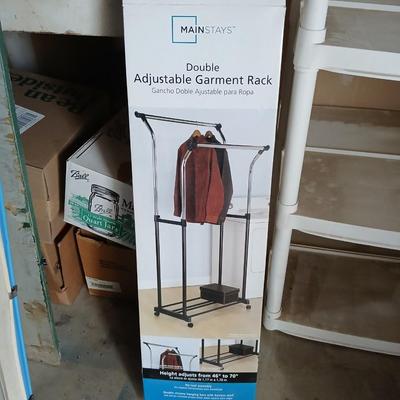 Opened Mainstays double Adjustable Garment / clothes rack