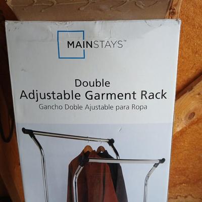 Opened Mainstays double Adjustable Garment / clothes rack