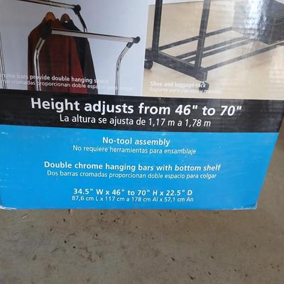 Opened Mainstays double Adjustable Garment / clothes rack