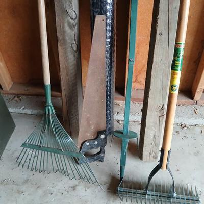 Gardening items - roll of new net fencing - short landscape timbers- rakes and more