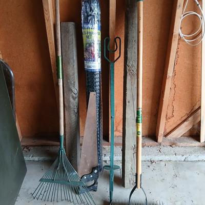 Gardening items - roll of new net fencing - short landscape timbers- rakes and more