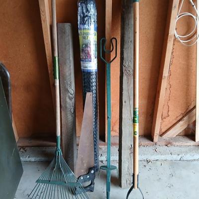 Gardening items - roll of new net fencing - short landscape timbers- rakes and more