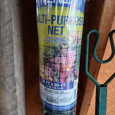 Gardening items - roll of new net fencing - short landscape timbers- rakes and more