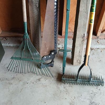 Gardening items - roll of new net fencing - short landscape timbers- rakes and more