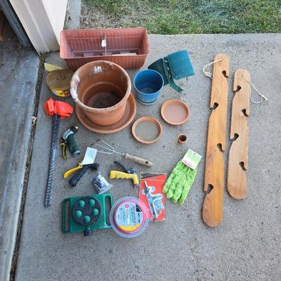 Gardening items - flowerpots - sprinkler - weed eater twine - hand tools - flags - new gate latch - gloves and more