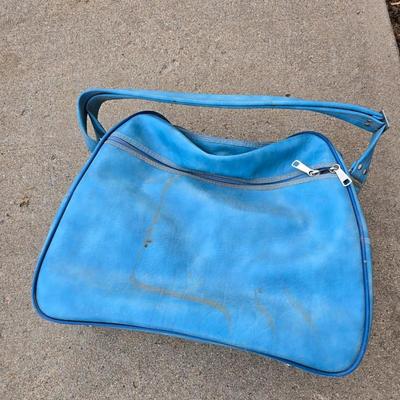 Two folding carts with assortment of luggage