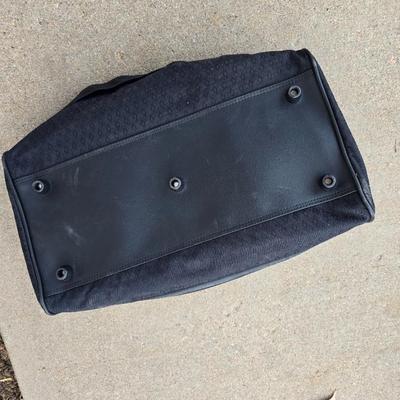 Two folding carts with assortment of luggage