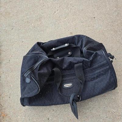 Two folding carts with assortment of luggage