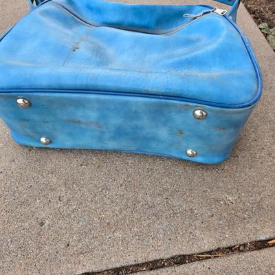 Two folding carts with assortment of luggage