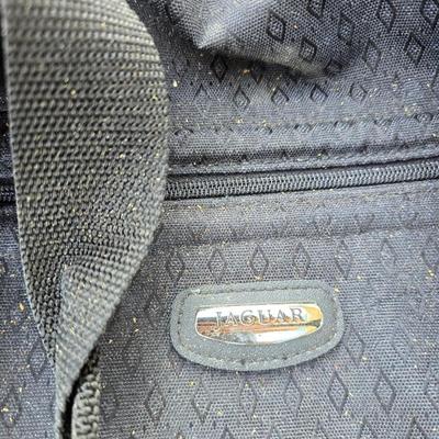 Two folding carts with assortment of luggage