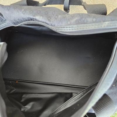 Two folding carts with assortment of luggage