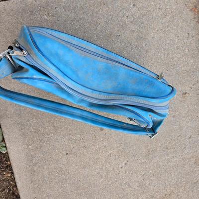 Two folding carts with assortment of luggage