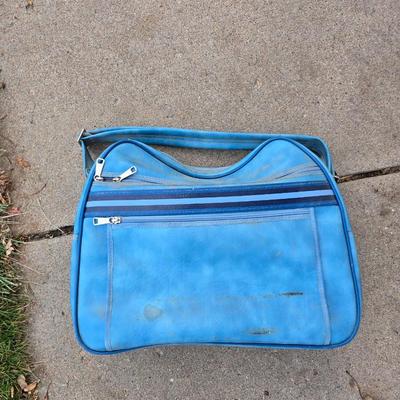 Two folding carts with assortment of luggage