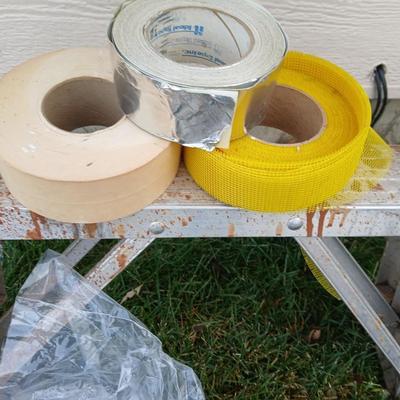 Ladder with an assortment of home repair items