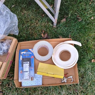 Ladder with an assortment of home repair items