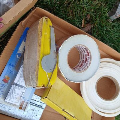 Ladder with an assortment of home repair items