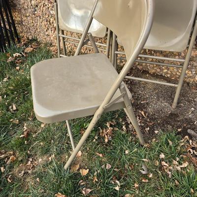 Six metal folding chairs