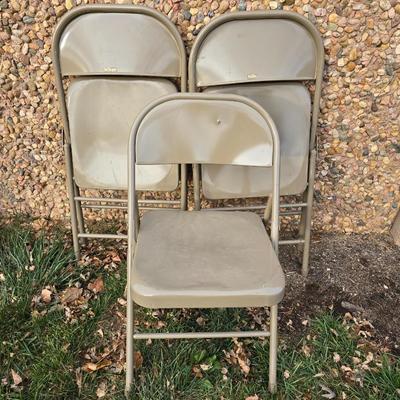 Six metal folding chairs