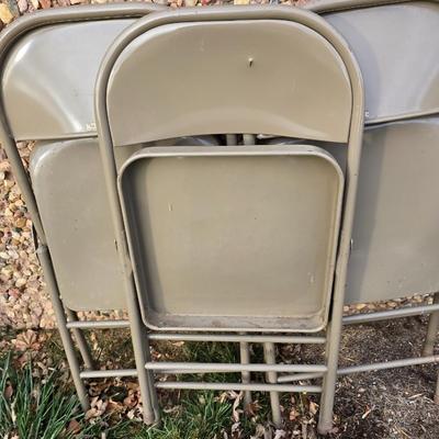 Six metal folding chairs