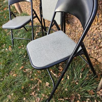 Six metal folding chairs