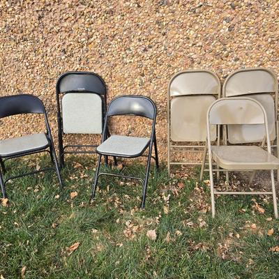 Six metal folding chairs