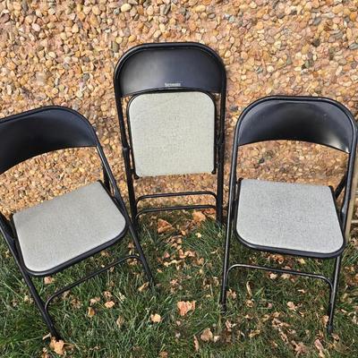 Six metal folding chairs