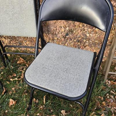 Six metal folding chairs