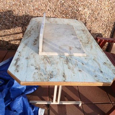 Metal framed foramina topped table with a marble countertop piece