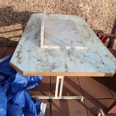 Metal framed foramina topped table with a marble countertop piece