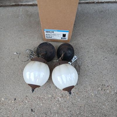 Two old lights with iridescent globes and a new stove pipe piece