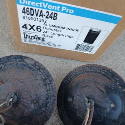 Two old lights with iridescent globes and a new stove pipe piece