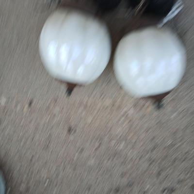 Two old lights with iridescent globes and a new stove pipe piece