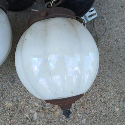 Two old lights with iridescent globes and a new stove pipe piece