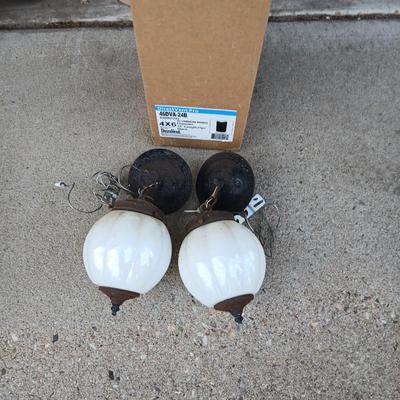 Two old lights with iridescent globes and a new stove pipe piece