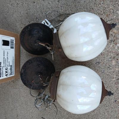 Two old lights with iridescent globes and a new stove pipe piece