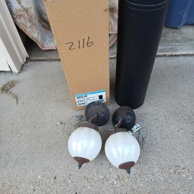 Two old lights with iridescent globes and a new stove pipe piece