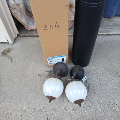 Two old lights with iridescent globes and a new stove pipe piece
